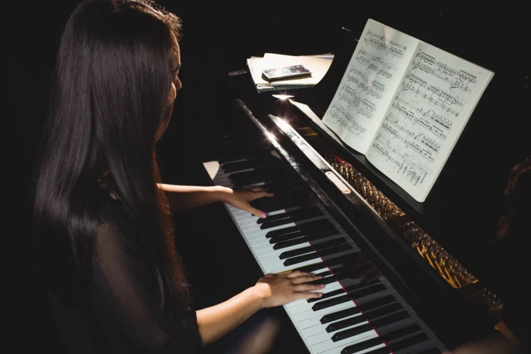 female-student-playing-piano_107420-64902